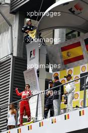 (L to R): Fernando Alonso (ESP) Ferrari, Sebastian Vettel (GER) Red Bull Racing, David Coulthard (GBR) Red Bull Racing and Scuderia Toro Advisor / BBC Television Commentator and Lewis Hamilton (GBR) Mercedes AMG F1 as Greenpeace make a protest against race title sponsors Shell at the podium. 25.08.2013. Formula 1 World Championship, Rd 11, Belgian Grand Prix, Spa Francorchamps, Belgium, Race Day.