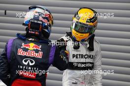 (L to R): Race winner Sebastian Vettel (GER) Red Bull Racing celebrates with third placed Lewis Hamilton (GBR) Mercedes AMG F1 in parc ferme. 25.08.2013. Formula 1 World Championship, Rd 11, Belgian Grand Prix, Spa Francorchamps, Belgium, Race Day.