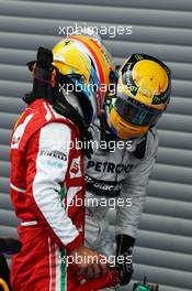 Fernando Alonso (ESP) Ferrari and Lewis Hamilton (GBR) Mercedes AMG F1 in parc ferme. 25.08.2013. Formula 1 World Championship, Rd 11, Belgian Grand Prix, Spa Francorchamps, Belgium, Race Day.