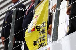 Greenpeace make a protest against race title sponsors Shell at the podium. 25.08.2013. Formula 1 World Championship, Rd 11, Belgian Grand Prix, Spa Francorchamps, Belgium, Race Day.