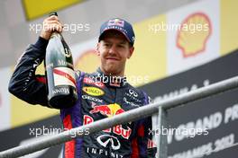 Race winner Sebastian Vettel (GER) Red Bull Racing celebrates on the podium. 25.08.2013. Formula 1 World Championship, Rd 11, Belgian Grand Prix, Spa Francorchamps, Belgium, Race Day.