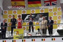 The podium (L to R): Fernando Alonso (ESP) Ferrari, second; Sebastian Vettel (GER) Red Bull Racing, race winner; Lewis Hamilton (GBR) Mercedes AMG F1, third. Greenpeace make a protest against race title sponsors Shell. 25.08.2013. Formula 1 World Championship, Rd 11, Belgian Grand Prix, Spa Francorchamps, Belgium, Race Day.