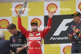 Fernando Alonso (ESP) Ferrari celebrates his second position on the podium. 25.08.2013. Formula 1 World Championship, Rd 11, Belgian Grand Prix, Spa Francorchamps, Belgium, Race Day.