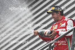 Race winner Fernando Alonso (ESP) Ferrari celebrates on the podium. 25.08.2013. Formula 1 World Championship, Rd 11, Belgian Grand Prix, Spa Francorchamps, Belgium, Race Day.