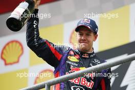 Race winner Sebastian Vettel (GER) Red Bull Racing celebrates on the podium. 25.08.2013. Formula 1 World Championship, Rd 11, Belgian Grand Prix, Spa Francorchamps, Belgium, Race Day.