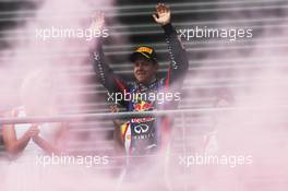 Race winner Sebastian Vettel (GER) Red Bull Racing celebrates on the podium. 25.08.2013. Formula 1 World Championship, Rd 11, Belgian Grand Prix, Spa Francorchamps, Belgium, Race Day.