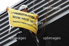 Greenpeace make a protest against race title sponsors Shell at the podium. 25.08.2013. Formula 1 World Championship, Rd 11, Belgian Grand Prix, Spa Francorchamps, Belgium, Race Day.