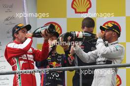 The podium (L to R): Fernando Alonso (ESP) Ferrari, second; Sebastian Vettel (GER) Red Bull Racing, race winner; Lewis Hamilton (GBR) Mercedes AMG F1, third. 25.08.2013. Formula 1 World Championship, Rd 11, Belgian Grand Prix, Spa Francorchamps, Belgium, Race Day.