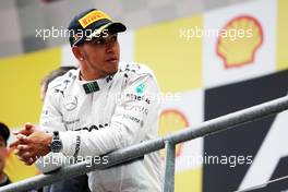 Lewis Hamilton (GBR) Mercedes AMG F1 on the podium. 25.08.2013. Formula 1 World Championship, Rd 11, Belgian Grand Prix, Spa Francorchamps, Belgium, Race Day.