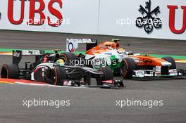 Esteban Gutierrez (MEX) Sauber C32 and Adrian Sutil (GER) Sahara Force India VJM06 battle for position. 25.08.2013. Formula 1 World Championship, Rd 11, Belgian Grand Prix, Spa Francorchamps, Belgium, Race Day.