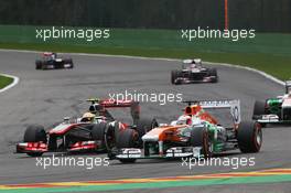 (L to R): Sergio Perez (MEX) McLaren MP4-28 and Paul di Resta (GBR) Sahara Force India VJM06 battle for position. 25.08.2013. Formula 1 World Championship, Rd 11, Belgian Grand Prix, Spa Francorchamps, Belgium, Race Day.