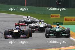 (L to R): Daniel Ricciardo (AUS) Scuderia Toro Rosso STR8 with Giedo van der Garde (NLD) Caterham CT03. 25.08.2013. Formula 1 World Championship, Rd 11, Belgian Grand Prix, Spa Francorchamps, Belgium, Race Day.