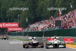 Adrian Sutil (GER) Sahara Force India VJM06 and Nico Hulkenberg (GER) Sauber C32. 25.08.2013. Formula 1 World Championship, Rd 11, Belgian Grand Prix, Spa Francorchamps, Belgium, Race Day.