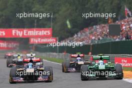 Jean-Eric Vergne (FRA) Scuderia Toro Rosso STR8 and Giedo van der Garde (NLD) Caterham CT03 battle for position. 25.08.2013. Formula 1 World Championship, Rd 11, Belgian Grand Prix, Spa Francorchamps, Belgium, Race Day.