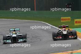 (L to R): Lewis Hamilton (GBR) Mercedes AMG F1 W04 and Romain Grosjean (FRA) Lotus F1 E21. 25.08.2013. Formula 1 World Championship, Rd 11, Belgian Grand Prix, Spa Francorchamps, Belgium, Race Day.