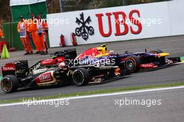 Romain Grosjean (FRA) Lotus F1 E21 and Mark Webber (AUS) Red Bull Racing RB9 battle for position. 25.08.2013. Formula 1 World Championship, Rd 11, Belgian Grand Prix, Spa Francorchamps, Belgium, Race Day.