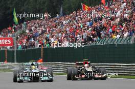 Lewis Hamilton (GBR) Mercedes AMG F1 W04 and Romain Grosjean (FRA) Lotus F1 E21 battle for position. 25.08.2013. Formula 1 World Championship, Rd 11, Belgian Grand Prix, Spa Francorchamps, Belgium, Race Day.