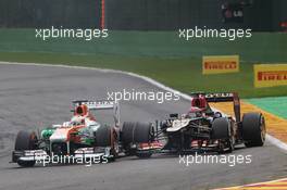 (L to R): Paul di Resta (GBR) Sahara Force India VJM06 and Kimi Raikkonen (FIN) Lotus F1 E21 battle for position. 25.08.2013. Formula 1 World Championship, Rd 11, Belgian Grand Prix, Spa Francorchamps, Belgium, Race Day.