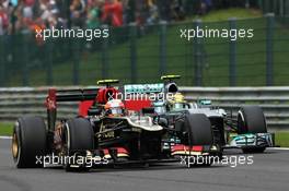 Romain Grosjean (FRA) Lotus F1 E21 and Lewis Hamilton (GBR) Mercedes AMG F1 W04 battle for position. 25.08.2013. Formula 1 World Championship, Rd 11, Belgian Grand Prix, Spa Francorchamps, Belgium, Race Day.