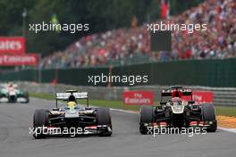 Esteban Gutierrez (MEX) Sauber C32 and Kimi Raikkonen (FIN) Lotus F1 E21 battle for position. 25.08.2013. Formula 1 World Championship, Rd 11, Belgian Grand Prix, Spa Francorchamps, Belgium, Race Day.