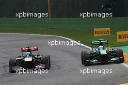 (L to R): Jean-Eric Vergne (FRA) Scuderia Toro Rosso STR8 and Giedo van der Garde (NLD) Caterham CT03. 25.08.2013. Formula 1 World Championship, Rd 11, Belgian Grand Prix, Spa Francorchamps, Belgium, Race Day.
