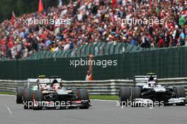 Nico Hulkenberg (GER) Sauber C32 and Valtteri Bottas (FIN) Williams FW35 battle for position. 25.08.2013. Formula 1 World Championship, Rd 11, Belgian Grand Prix, Spa Francorchamps, Belgium, Race Day.