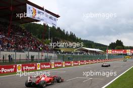 Fernando Alonso (ESP) Ferrari F138 passes a Greenpeace protest. 25.08.2013. Formula 1 World Championship, Rd 11, Belgian Grand Prix, Spa Francorchamps, Belgium, Race Day.