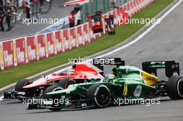 Jules Bianchi (FRA) Marussia F1 Team MR02 and Charles Pic (FRA) Caterham CT03 battle for position. 25.08.2013. Formula 1 World Championship, Rd 11, Belgian Grand Prix, Spa Francorchamps, Belgium, Race Day.