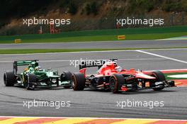 Jules Bianchi (FRA) Marussia F1 Team MR02 and Charles Pic (FRA) Caterham CT03. 25.08.2013. Formula 1 World Championship, Rd 11, Belgian Grand Prix, Spa Francorchamps, Belgium, Race Day.