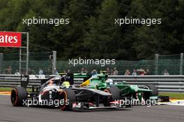 Esteban Gutierrez (MEX) Sauber C32 and Giedo van der Garde (NLD) Caterham CT03 battle for position. 25.08.2013. Formula 1 World Championship, Rd 11, Belgian Grand Prix, Spa Francorchamps, Belgium, Race Day.