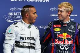 (L to R): Pole sitter Lewis Hamilton (GBR) Mercedes AMG F1 with second placed Sebastian Vettel (GER) Red Bull Racing in parc ferme. 24.08.2013. Formula 1 World Championship, Rd 11, Belgian Grand Prix, Spa Francorchamps, Belgium, Qualifying Day.