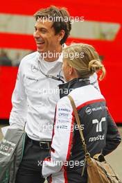(L to R): Toto Wolff (GER) Mercedes AMG F1 Shareholder and Executive Director with his wife Susie Wolff (GBR) Williams Development Driver. 24.08.2013. Formula 1 World Championship, Rd 11, Belgian Grand Prix, Spa Francorchamps, Belgium, Qualifying Day.