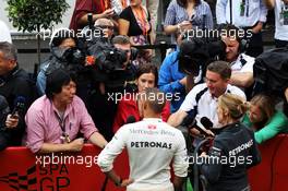 Lewis Hamilton (GBR) Mercedes AMG F1 with the media. 24.08.2013. Formula 1 World Championship, Rd 11, Belgian Grand Prix, Spa Francorchamps, Belgium, Qualifying Day.