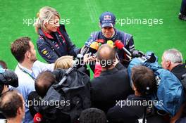 Sebastian Vettel (GER) Red Bull Racing with the media. 24.08.2013. Formula 1 World Championship, Rd 11, Belgian Grand Prix, Spa Francorchamps, Belgium, Qualifying Day.