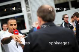 Lewis Hamilton (GBR) Mercedes AMG F1 describes his pole lap with Martin Brundle (GBR) Sky Sports Commentator in the paddock. 24.08.2013. Formula 1 World Championship, Rd 11, Belgian Grand Prix, Spa Francorchamps, Belgium, Qualifying Day.