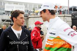 (L to R): Loic Duval (FRA) Audi Le Mans winner with Adrian Sutil (GER) Sahara Force India F1. 25.08.2013. Formula 1 World Championship, Rd 11, Belgian Grand Prix, Spa Francorchamps, Belgium, Race Day.