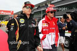 (L to R): Kimi Raikkonen (FIN) Lotus F1 Team with Fernando Alonso (ESP) Ferrari on the drivers parade. 25.08.2013. Formula 1 World Championship, Rd 11, Belgian Grand Prix, Spa Francorchamps, Belgium, Race Day.