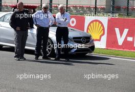 Charlie Whiting (GBR) FIA Delegate has a look at the groves on the grid. 22.08.2013. Formula 1 World Championship, Rd 11, Belgian Grand Prix, Spa Francorchamps, Belgium, Preparation Day.