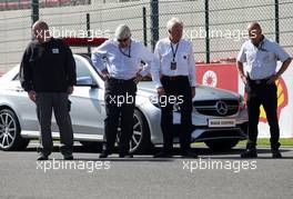 Charlie Whiting (GBR) FIA Delegate has a look at the groves on the grid. 22.08.2013. Formula 1 World Championship, Rd 11, Belgian Grand Prix, Spa Francorchamps, Belgium, Preparation Day.