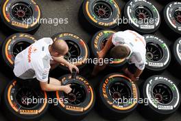 McLaren mechanics with Pirelli tyres. 22.08.2013. Formula 1 World Championship, Rd 11, Belgian Grand Prix, Spa Francorchamps, Belgium, Preparation Day.