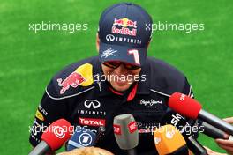 Sebastian Vettel (GER) Red Bull Racing with the media. 22.08.2013. Formula 1 World Championship, Rd 11, Belgian Grand Prix, Spa Francorchamps, Belgium, Preparation Day.