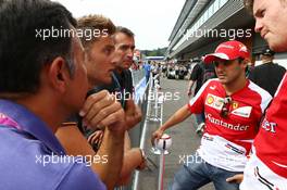 (L to R): Felipe Massa (BRA) Ferrari and Rob Smedley (GBR) Ferrari Race Engineer with fans. 22.08.2013. Formula 1 World Championship, Rd 11, Belgian Grand Prix, Spa Francorchamps, Belgium, Preparation Day.