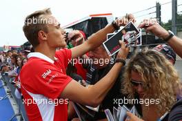 Max Chilton (GBR) Marussia F1 Team signs autographs for the fans. 22.08.2013. Formula 1 World Championship, Rd 11, Belgian Grand Prix, Spa Francorchamps, Belgium, Preparation Day.