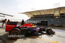 Sebastian Vettel (GER) Red Bull Racing RB9 leaves the pits. 19.04.2013. Formula 1 World Championship, Rd 4, Bahrain Grand Prix, Sakhir, Bahrain, Practice Day