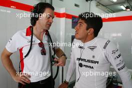 (L to R): Marc Hynes (GBR) Marussia F1 Team Driver Coach with Rodolfo Gonzalez (VEN) Marussia F1 Team Reserve Driver. 19.04.2013. Formula 1 World Championship, Rd 4, Bahrain Grand Prix, Sakhir, Bahrain, Practice Day