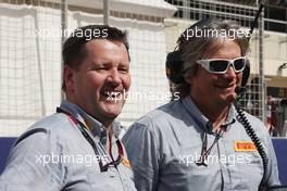 (L to R): Paul Hembery (GBR) Pirelli Motorsport Director and Max Damiani (ITA) Pirelli F1 Chief Engineer Co-ordinator on the grid. 21.04.2013. Formula 1 World Championship, Rd 4, Bahrain Grand Prix, Sakhir, Bahrain, Race Day