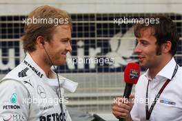 Nico Rosberg (GER) Mercedes AMG F1 on the grid with Luca Filippi (ITA) Sky Sports F1 TV Presenter. 21.04.2013. Formula 1 World Championship, Rd 4, Bahrain Grand Prix, Sakhir, Bahrain, Race Day