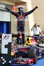 Race winner Sebastian Vettel (GER) Red Bull Racing RB9 celebrates in parc ferme. 21.04.2013. Formula 1 World Championship, Rd 4, Bahrain Grand Prix, Sakhir, Bahrain, Race Day
