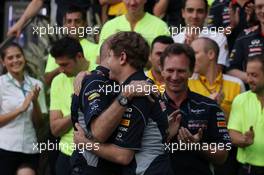 Race winner Sebastian Vettel (GER) Red Bull Racing celebrates with Adrian Newey (GBR) Red Bull Racing Chief Technical Officer and the team. 21.04.2013. Formula 1 World Championship, Rd 4, Bahrain Grand Prix, Sakhir, Bahrain, Race Day