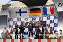 The podium (L to R): Kimi Raikkonen (FIN) Lotus F1 Team, second; Sebastian Vettel (GER) Red Bull Racing, race winner; Romain Grosjean (FRA) Lotus F1 Team, third. 21.04.2013. Formula 1 World Championship, Rd 4, Bahrain Grand Prix, Sakhir, Bahrain, Race Day